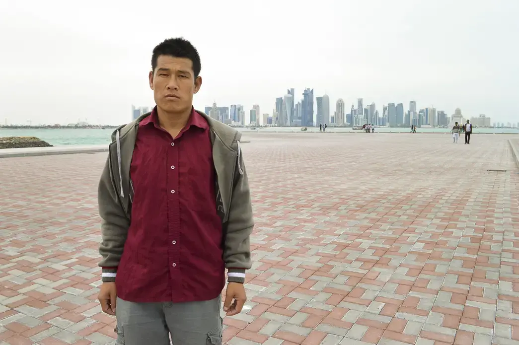 Tirtha Raj Tamang, a Nepalese migrant worker, says he was exploited by a Nepalese company that sent him to work in Qatar. He was photographed in Doha, Qatar's capital city. Image by Shilu Manandhar. Qatar, 2016.