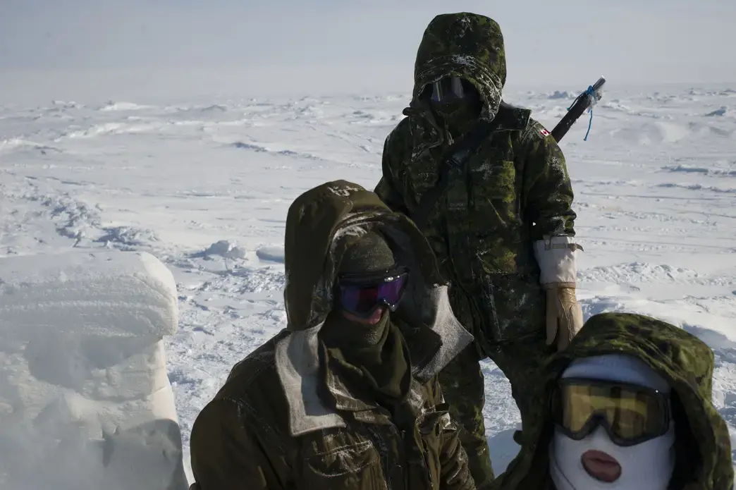 Canadian soldiers on the ice Sheet near Little Cornwallis Island during a military operation in -57 C weather in Nunavut Canada. Image by Louie Palu. Canada, 2017.
