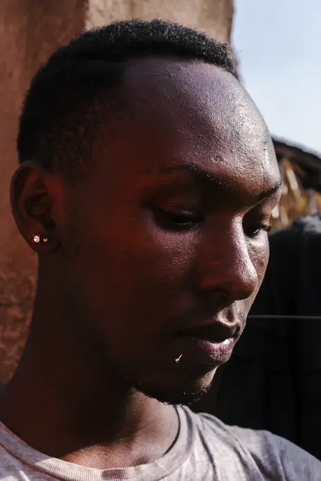 Javan&nbsp;Mugisha, 19, a transgender woman, poses for a portrait near her home in Kampala. She left Uganda&nbsp;after a mob beat her, stripped her naked and paraded her up and down the street yelling, 'He's a homo,' behind her. She fled to Kenya and spent nearly a year there as a refugee before returning&nbsp;to Uganda in order to make a stand and reconcile with her family. But&nbsp;now, she faces a stream of abuse from the general public. Image by Jake Naughton. Uganda, 2017.