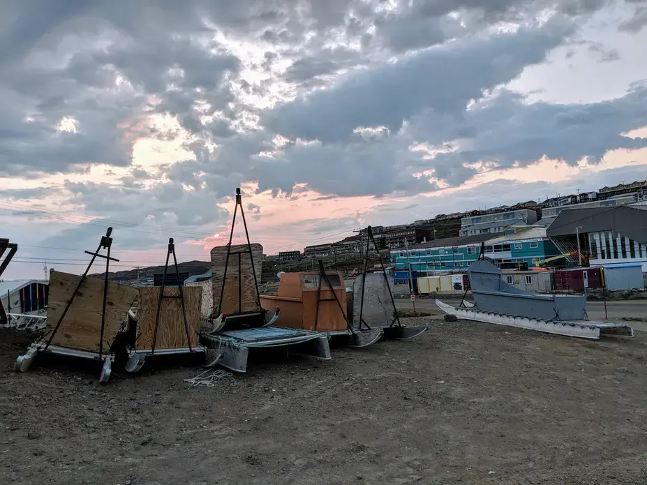 Qamutiks (Inuit sleds) lined up outside Iqaluit’s high school. Image by Julie De Meulemeester. Canada, 2018.