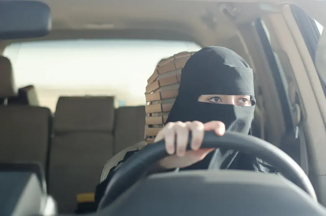 Woman driving in Saudi Arabia. Image by Shutterstock. Saudi Arabia, 2018.