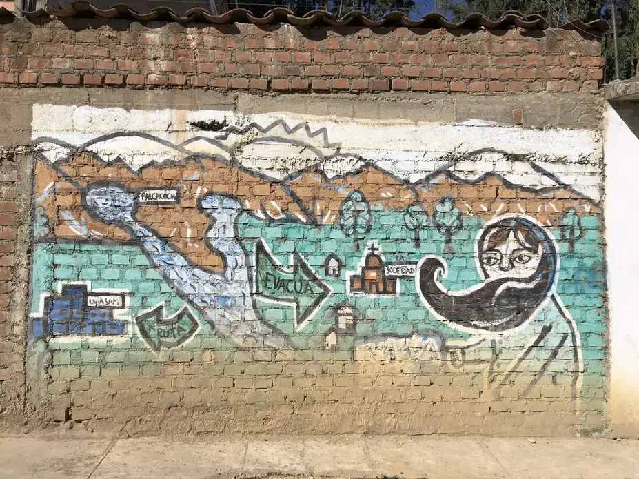 A mural in Nueva Florida depicts an evacuation plan should Palcacocha overflow. Image by Audrey Fromson. Peru, 2019.