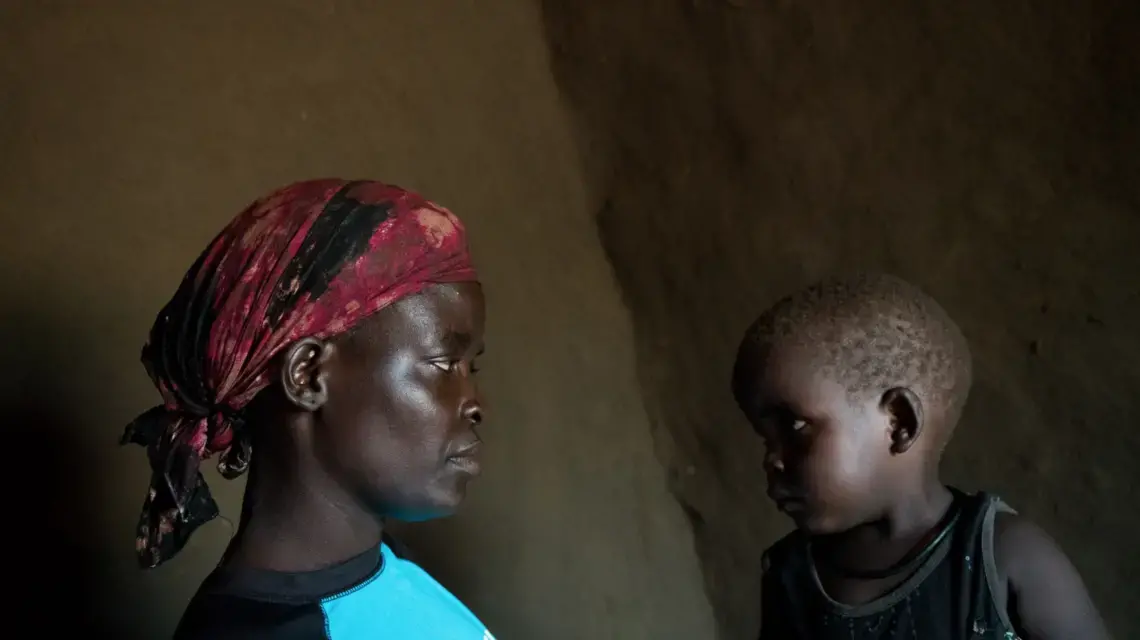 Lilias Diria with her son Abraham, age 2, in their home in the Bidi Bidi settlement in Uganda, June 25, 2019. Image by Adriane Ohanesian. Uganda, 2019.
