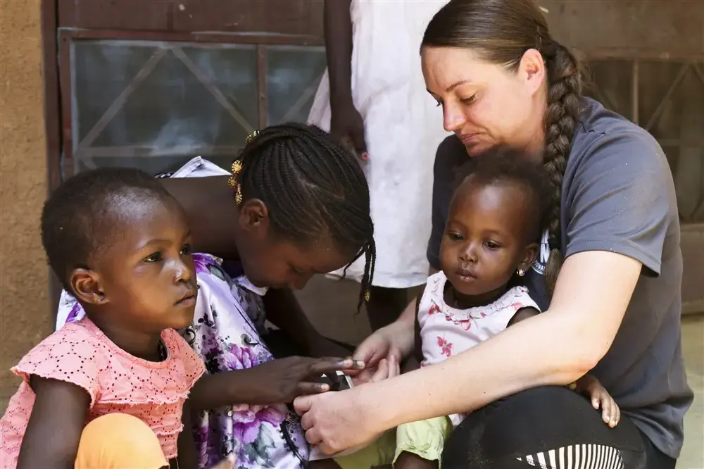 A U.S. military member interacts with orphans at Saint Vincent Orphanage of Niamey during Flintlock 2018 in Niamey, Niger. U.S. Army photo by Sgt. Heather Doppke/79th Theater Sustainment Command. Nigeria, 2018.
