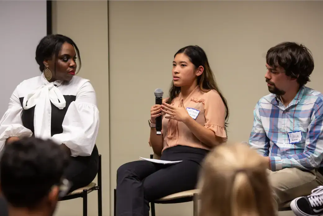 Micah Castelo (Syracuse University) responds to an audience question during the "Migration and Displacement" Q&amp;A session on Day One of Washington Weekend. Castelo is joined onstage by fellow panelists Angelica Ekeke (Berkeley Graduate School of Journalism) and Patrick Ammerman (University of Pennsylvania). Image by Claire Seaton. United States, 2019.