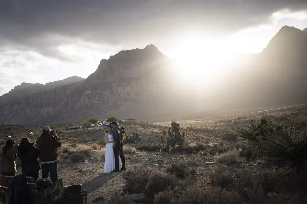 A couple poses for wedding photographs in the Red Rock National Conservation Area near Las Vegas, Sunday, Nov. 8, 2020. Image by Wong Maye-E / AP Photo. United States, 2020.