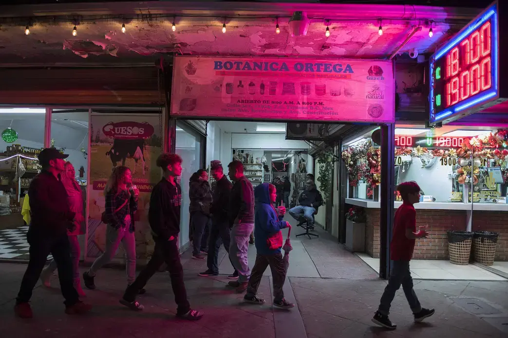 The Flores family strolls through downtown Tijuana on their way back to their car Nov. 30. Image by Amanda Cowan. Mexico, 2019.