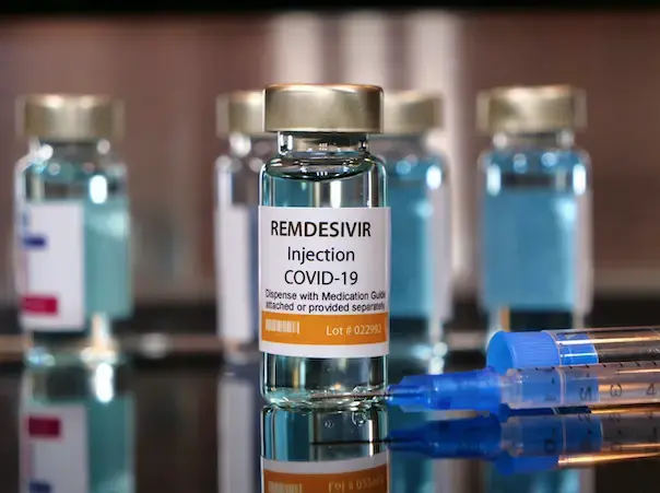 Vial of the drug remdesivir with syringe for COVID-19 treatment. Image by Bernard Chantal / Shutterstock. 2020.