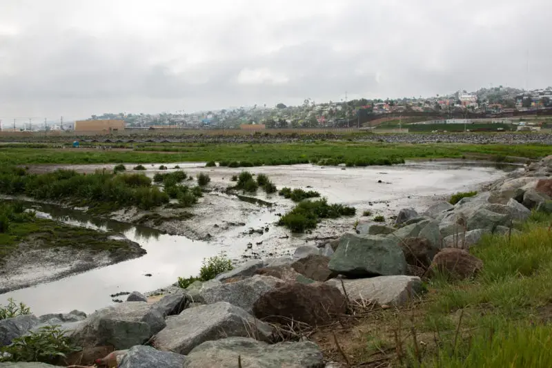 A tributary near the U.S.-Mexico border where sewage from Tijuana flows through. Image by Adriana Heldiz / Voice of San Diego. United States, undated.