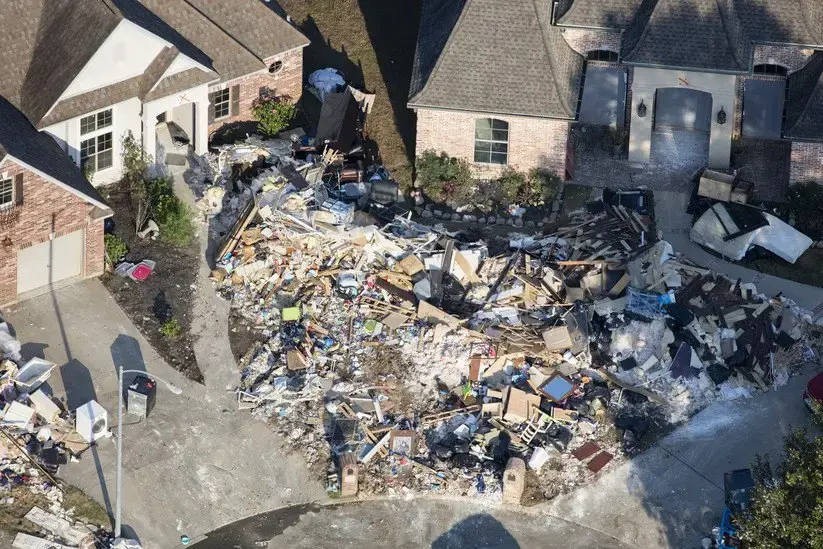 Hurricane Harvey is expected to be the costliest natural disaster in U.S. history. Thousands of homes were flooded, many requiring major repairs. Here debris piles await removal from gutting two homes in Northwest Forest, a subdivisions of Beaumont. Image by Dan Grossman. United States, 2017. 