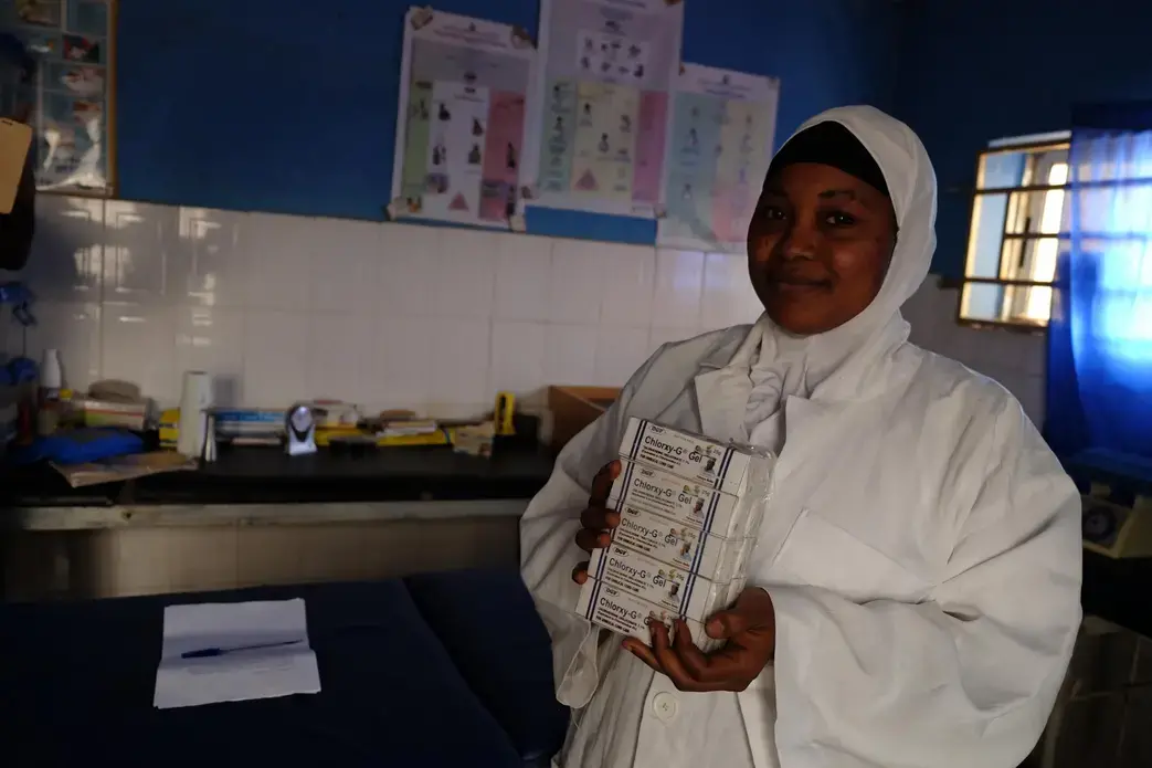 Fatima Yakubu, a Nigerian community health extension worker, holds tubes of chlorhexidine digluconate 7.1 percent gel. Yakubu’s rural primary health care facility is one of about 120 clinics in the central Nigerian state of Kogi that are supported by USAID’s Maternal and Child Survival Program. Image by T.R. Goldman. Nigeria, 2017.
