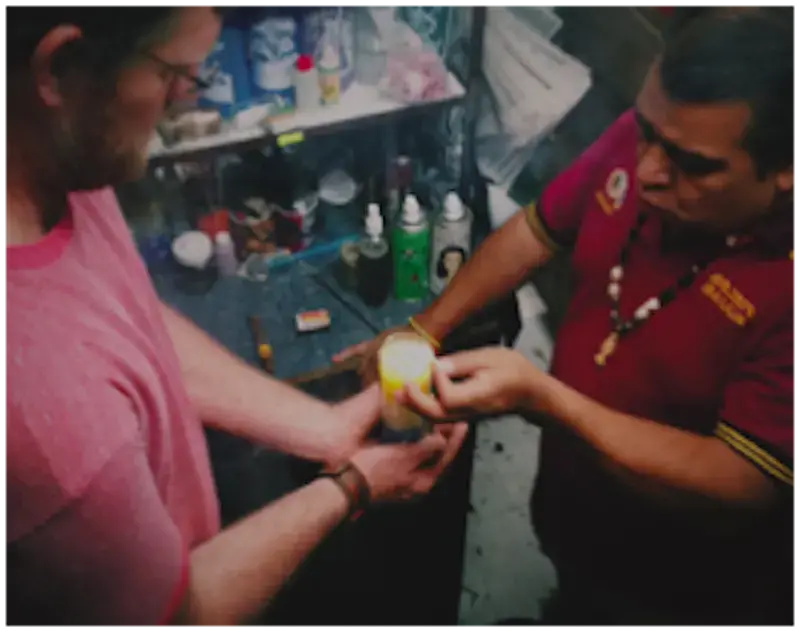 Erik Vance participates in a blessing with a Mexican brujo, or witch doctor, in which he has a self-inflicted curse lifted from him