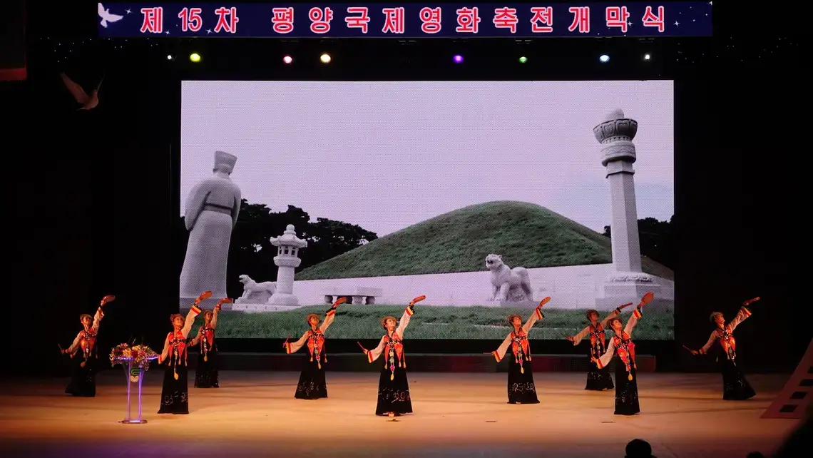 Women dressed in traditional Korean dresses performing at the opening ceremony of the 15th Pyongyang International Film Festival. Image by Laya Maheshwari. North Korea, 2016.