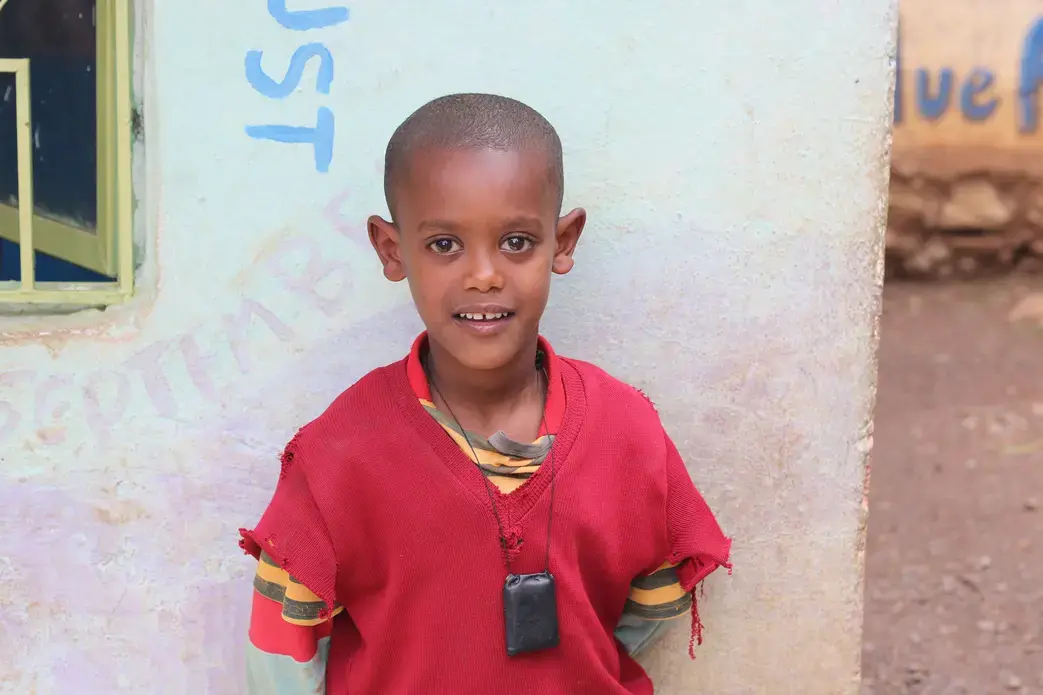 Natie Asnaunew poses for a photo at the day care center in Gondar Ethiopia. This day care center is run by Yenege Tesfa, Hope for Tomorrow, and it allows single mothers to drop their kids of everyday so they are able to go to work and help provide for their family. Image by Abigail Bekele. Ethiopia, 2018