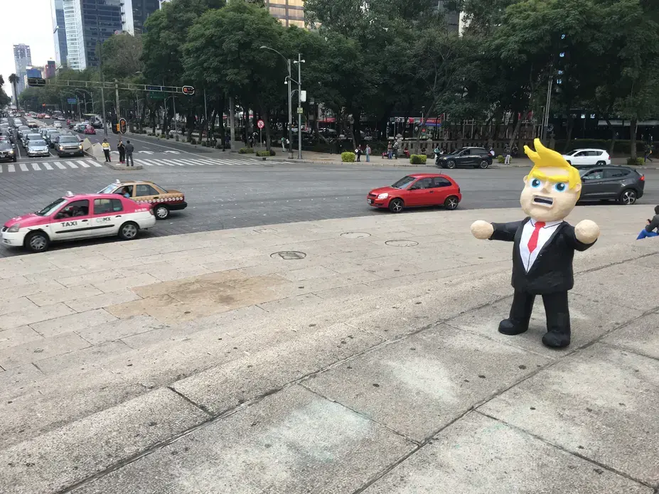 A Donald Trump piñata in the center of Mexico City. Many Mexicans are deeply fearful of Trump's enacting his campaign promises to cancel or alter NAFTA, restrict remittances sent to Mexico from the United States, deport millions of undocumented immigrants living in the U.S., and build a wall along the U.S.-Mexico border. Image by Nick Schifrin. Mexico, 2016.