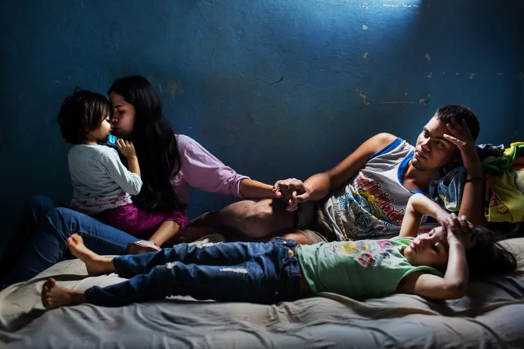 Richard and Elixa and their two daughters. Image by Natalie Keyssar. Venezuela, 2016.