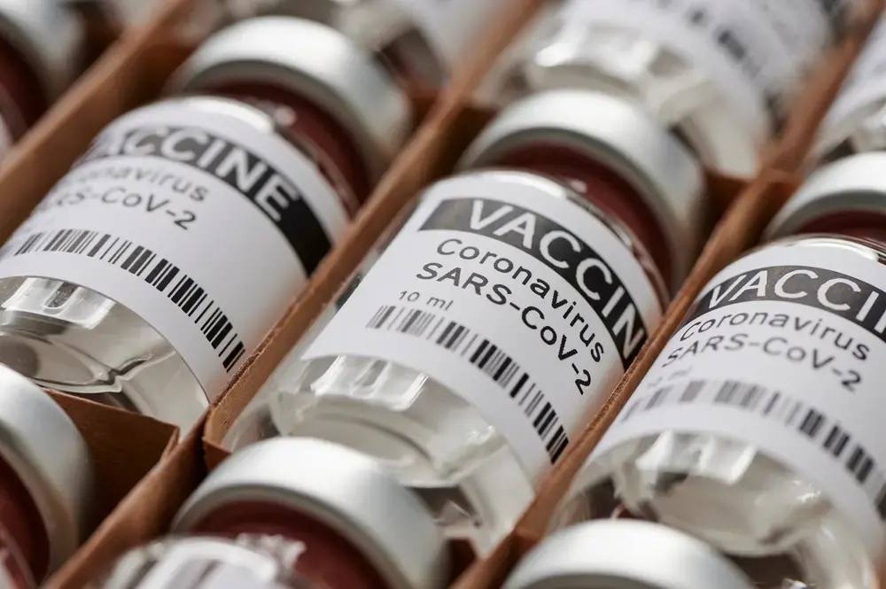 Ampoules containing coronavirus vaccine. Image by M-Foto / Shutterstock. 2020.