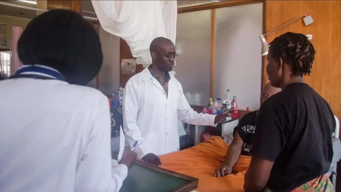 Stanley Zimba examines a patient. Image courtesy of DMS Productions/Dawson Sikute. Zambia, 2019.