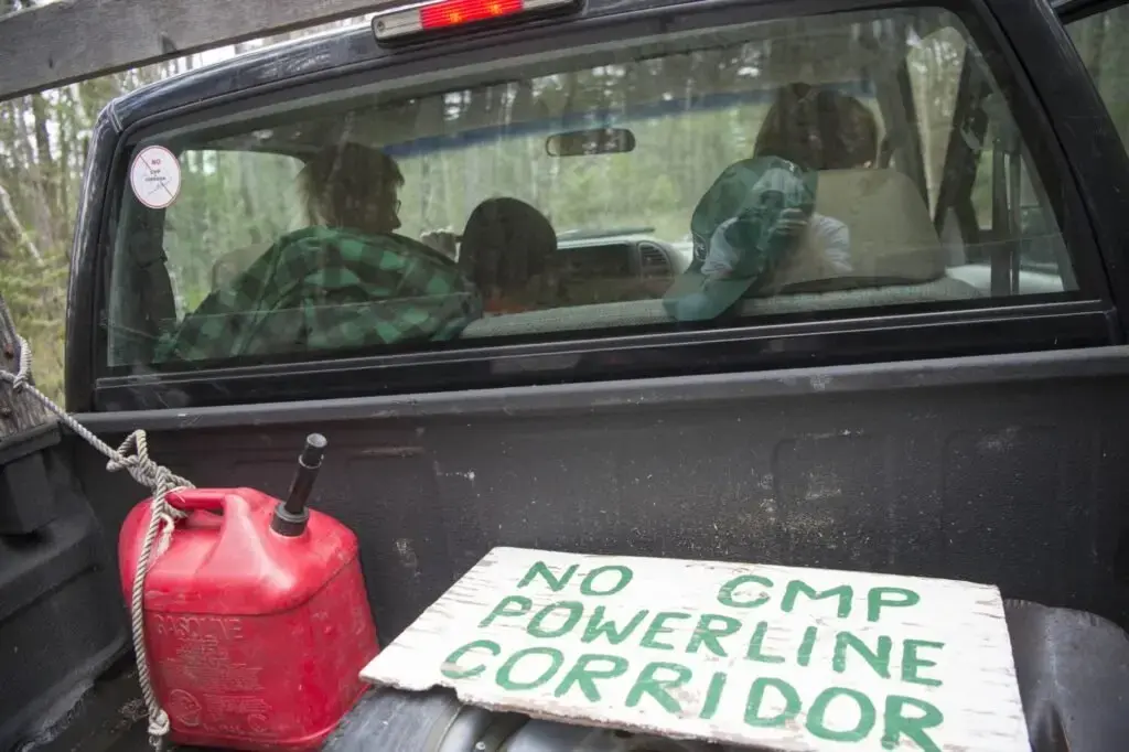 Duane Hanson drives down to mile 10 on Spencer Road in the Unorganized Territories in the north woods of Maine near T5 R7 on May 27, 2019. Hanson has called T5 R7 home for the past 40 years. His intention was to find a place that was wild and accessible only by plane. Image by Michael G. Seamans. United States, 2019.