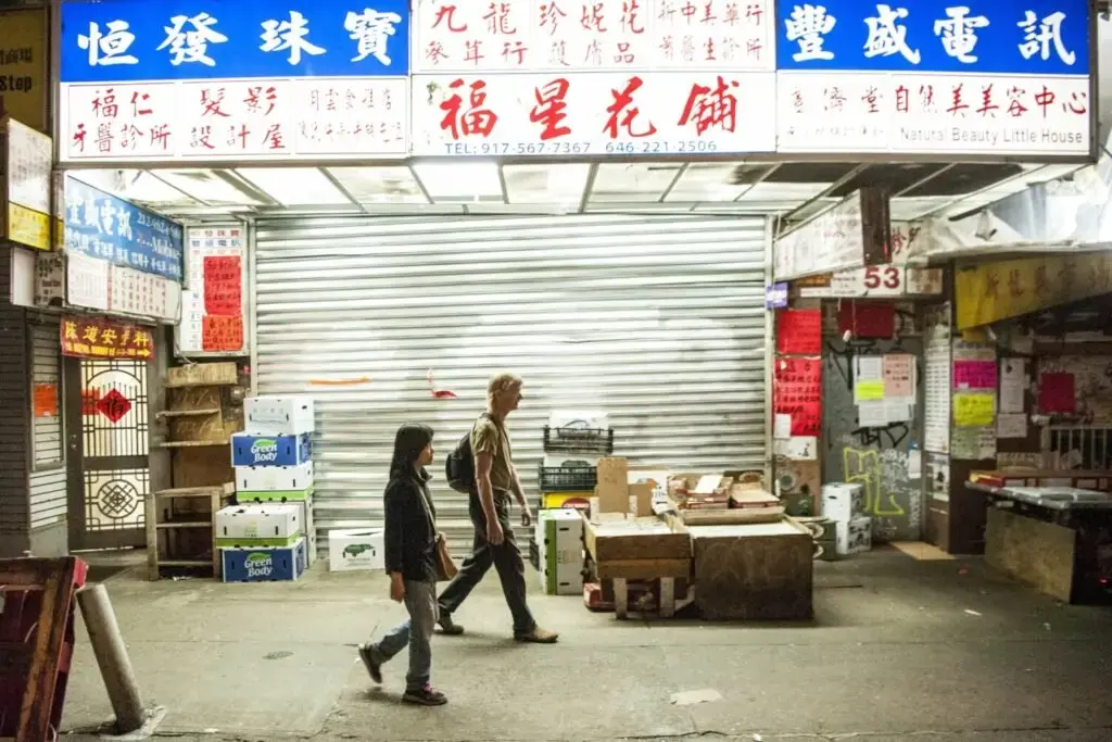 Sally Kwan and Duane Hanson walk the streets in Chinatown, Manhattan, on May 19, 2019. Image by Michael G. Seamans. United States, 2019.
