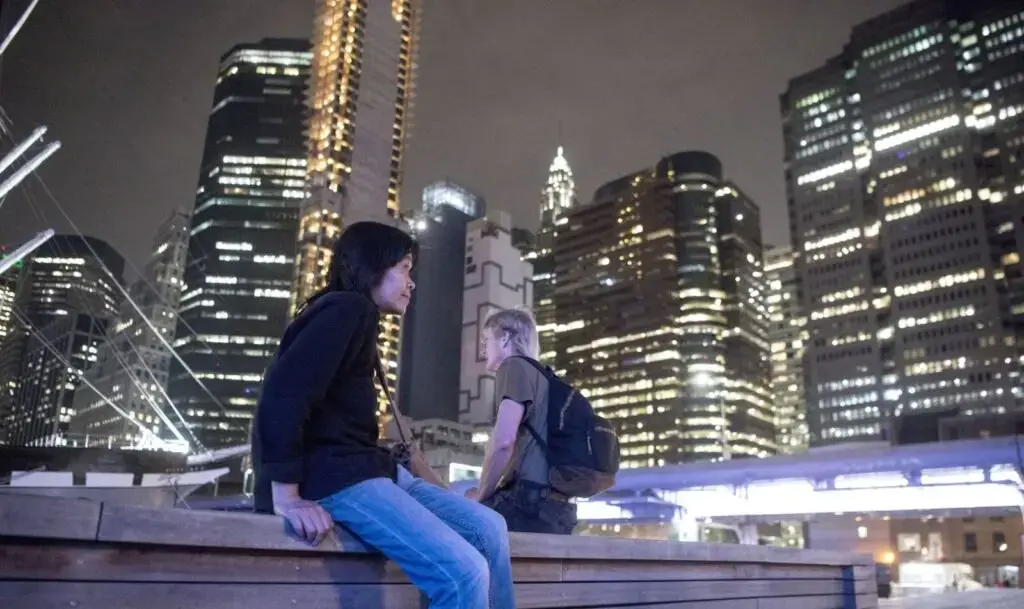 Sally Kwan and Duane Hanson take a break along the East River in Chinatown, Manhattan, during a visit to Kwan's home on May 19, 2019. Image by Michael G. Seamans. United States, 2019.