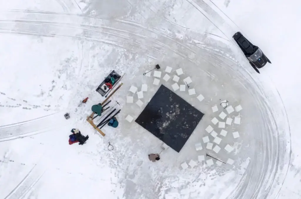 Duane Hanson hauls 16-inch square blocks of ice from his pond in T5 R7 in the Unorganized Territories on Jan. 4, 2020. The ice will be stored in an ice house with saw dust to be used to refrigerate food throughout the year. Image by Michael G. Seamans. United States, 2019.