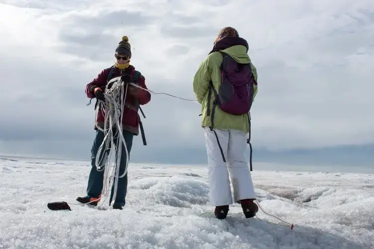 The Greenland ice sheet is 10,000 feet thick in the center. “You can't go there. You can't see it,” Joel Harper says. That’s why he has his students working on mapping the bed with radar. Image by Amy Martin. Greenland, 2018. 