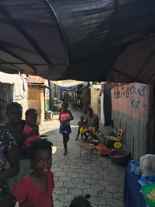 Women in a market in Cite Soleil, Port-au-Prince. Image by Kate Corrigan. Haiti, 2017.<br />
