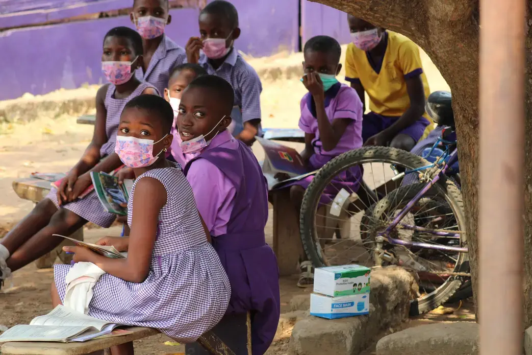 children at primary school in Ghana wearing masks