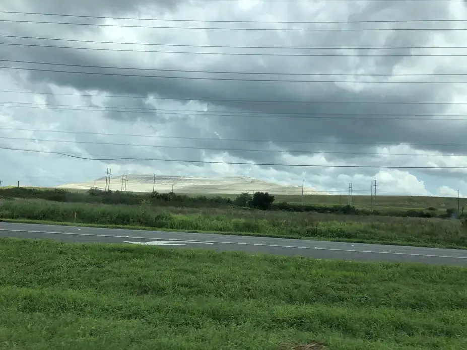 phosphogypsum stack rises in the distanc