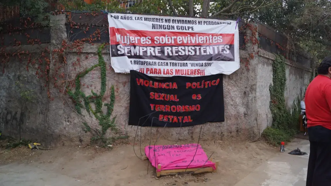 A sign reading “Sexual political violence is state terror.”