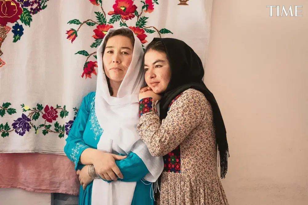 A mother and daughter embrace