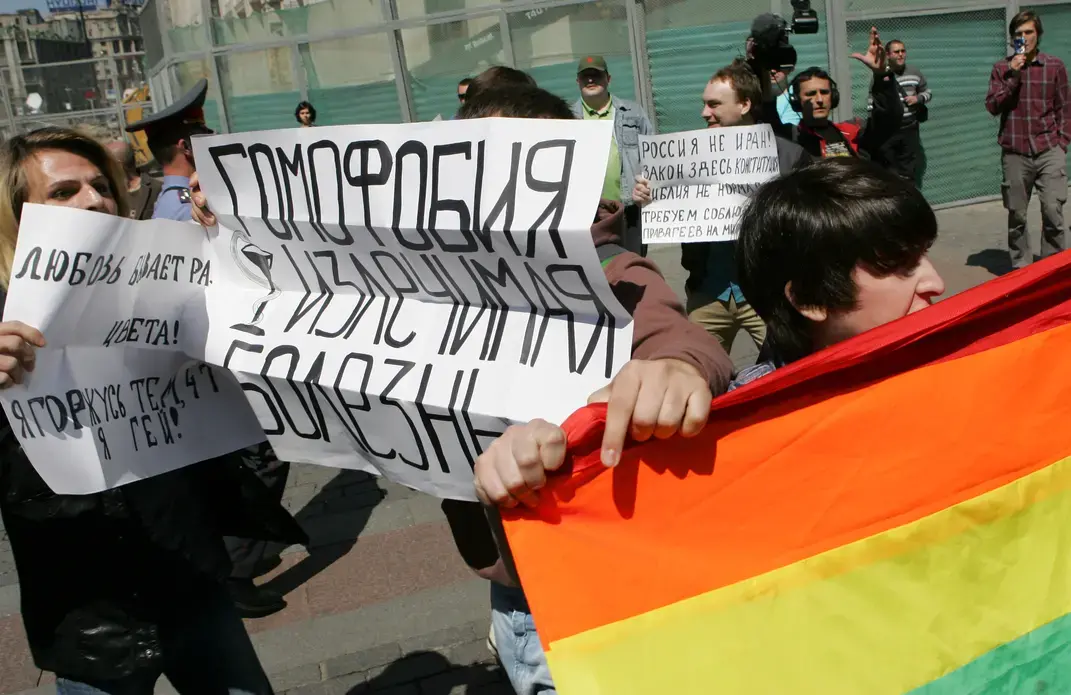 Gay rights activists take part in the unauthorized gay pride parade in central Moscow, Russia on May 28, 2011. The banner in center reads "Homophobia can be cured." Image courtesy of Shutterstock. Russia, 2011.