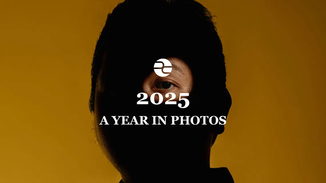 2025 Year in Photos, Pulitzer Center. superimposed over a photo of a man mostly obscured by light
