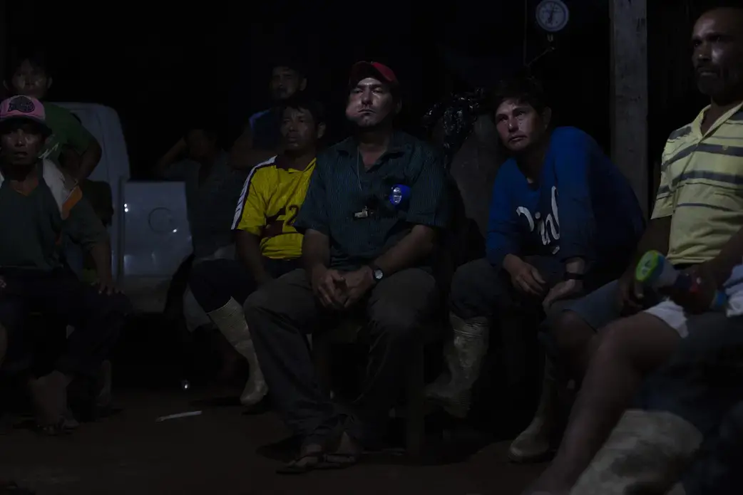On average, Bolivians eat less than three kilos of fish per person per year, and at least half of what they do it is imported from neighboring countries. The result is depressed prices on products fished within Bolivia. In San Lorenzo, fishermen gathered on a hot summer night to talk about the possibility of unionizing to demand a fair price paiche. Image by Felipe Luna. Bolivia, 2018.