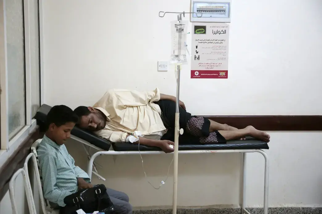 In this July 1, 2017 file photo, a man is treated for suspected cholera infection at a hospital in Sanaa, Yemen. An Associated Press investigation finds that Yemen’s massive cholera epidemic was aggravated by corruption and official intransigence. The investigation has found that both the Iranian-backed Houthis rebels and their main adversary in the war—the U.S.—and Saudi-backed government that controls southern Yemen—impeded efforts by relief groups to stem the epidemic. Image by Hani Mohamed/AP Photo…