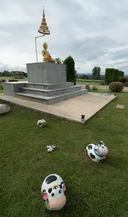A shrine to Buddha is shown at the packaging plant for the Pakchong Dairy Cooperative in Pak Chong, Thailand. Image by Mark Hoffman. Thailand, 2019. 