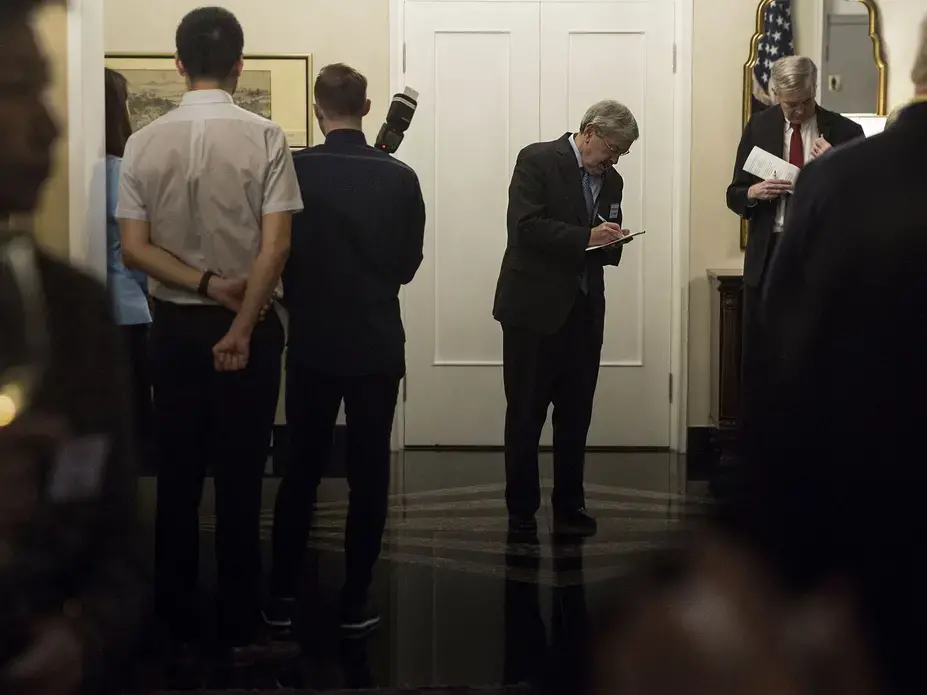 U.S. Ambassador to China Terry Branstad makes notes before giving remarks while hosting Missouri Gov. Eric Greitens and a delegation from the state during a reception at the ambassador's residence on Sunday, Sept. 24, 2017, in Beijing, China. Image by Kelsey Kremer. China, 2017.
