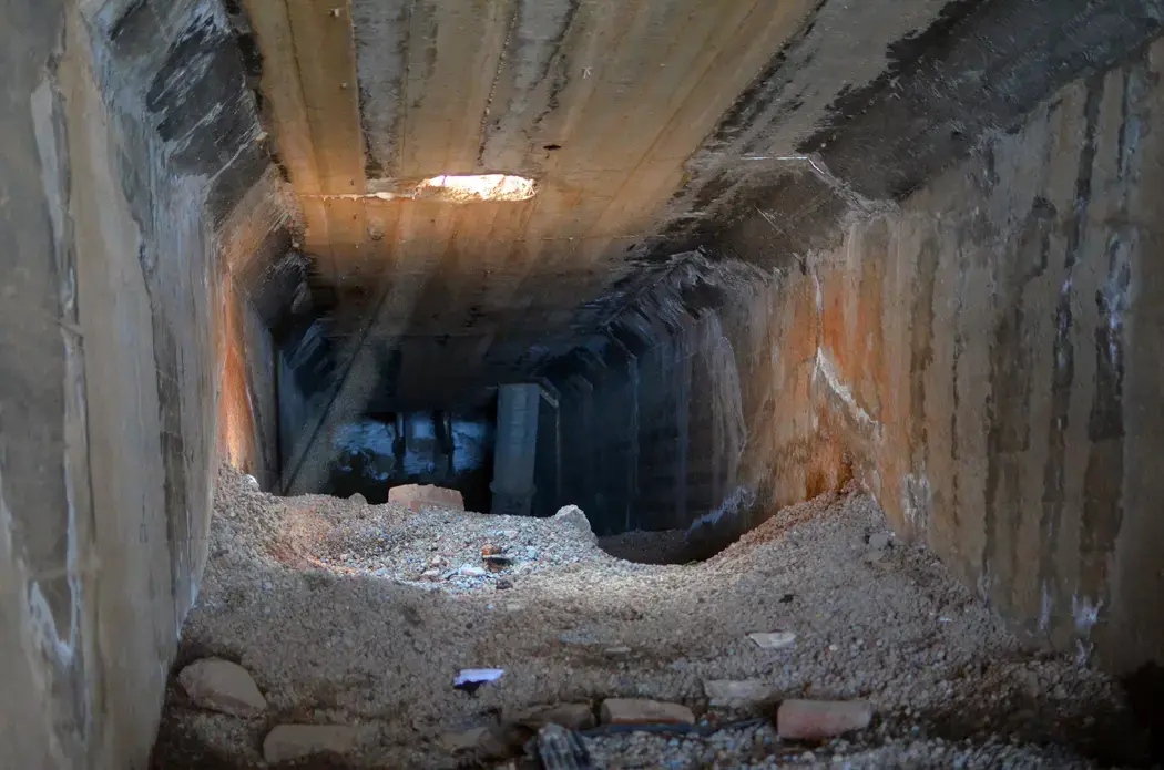 An unsealed shaft at the Blyvooruitzicht Gold Mine serves as an entrance for zama zamas. Image by Mark Olalde. South Africa, 2017.