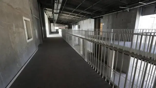 The second floor hallway inside the new General Hospital. The sprawling new hospital campus was one of the first projects approved for reconstruction following Haiti’s earthquake of Jan. 12, 2010. A decade later, the 534-bed teaching hospital has yet to open its doors to a single patient. Image by Jose A. Iglesias. Haiti, 2019.