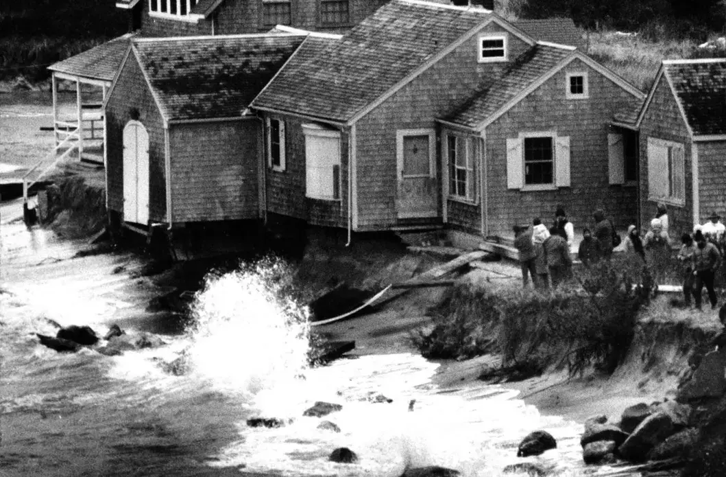 Erosion threatened a house on Andrew Harding Road in Chatham during a storm at high tide on Jan. 20, 1988. Image by Barry Chin. United States, 1988.