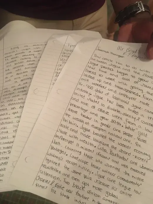 Image of essays written by students that capture their reflections on an essay by Khalil Gibran Mohammad about the history of sugar in the United States as part of The 1619 Project.