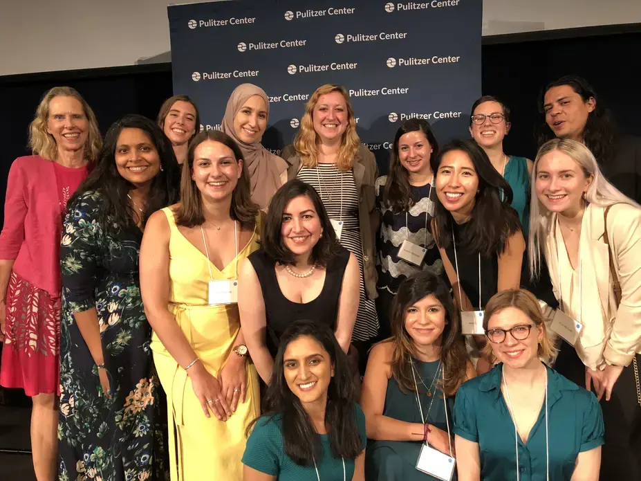 Pulitzer Center student fellows and alums attend the Beyond War dinner. Front row, left to right: Contributing editor Kem Sawyer, Neeta Satam, University of Missouri '17; Liz Scherffius, Columbia University '18; Sawsan Morrar, UC Berkeley '17; Rebecca Gibian, University of Southern California '15 Yasmin Bendaas, Wake Forest University '12; Sarah Hoenicke, UC Berkeley '18; Kristian Hernandez, American University '18. middle row: Julia Canney, William & Mary '18; Flaviana Sandoval-Padilla, Boston University '18; Jessie Li, Davidson College '14; Erin McGoff, American University '17. Front row: Divya Mishra, Johns Hopkins School of Public Health '18; Lila Franco, Wake Forest University '17; Thea Piltzecker, Columbia University '17. Missing from photo: Sydney Combs, University of Chicago '15; Camila DeChalus, American University '16; Arianne Henry, Boston University '18; and Merdie Nzanga, Howard University '18. Image by Kayla Sharpe. Washington, D.C., 2018.