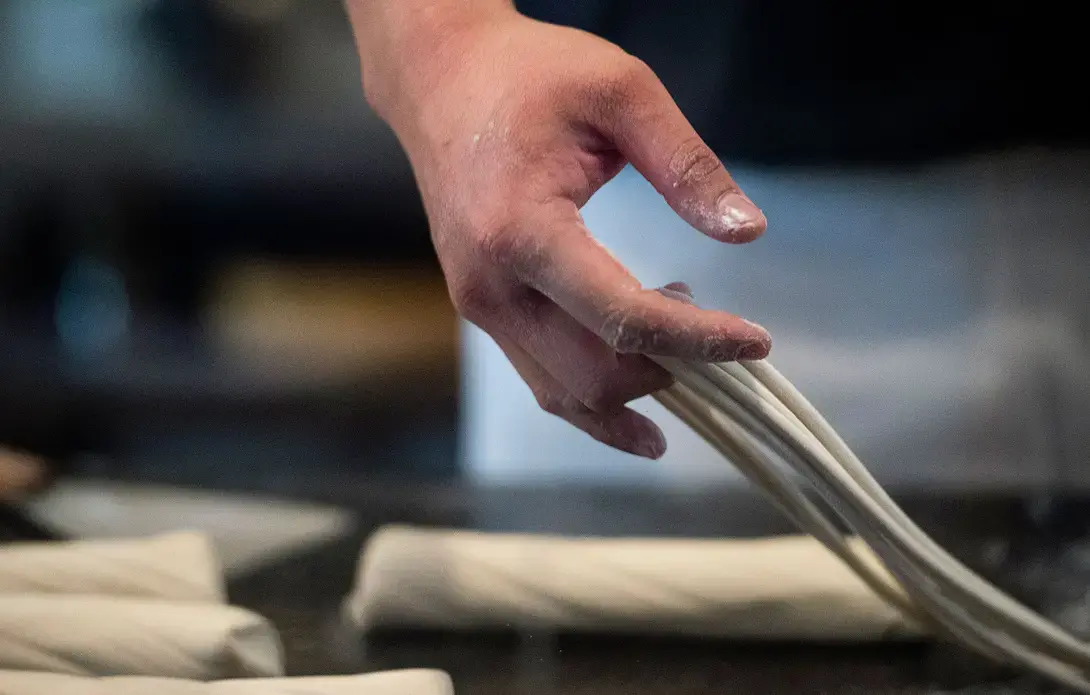 Tony Mao makes noodles at Everyday Noodles in Squirrel Hill. Image by Steph Chambers. United States, 2018. 