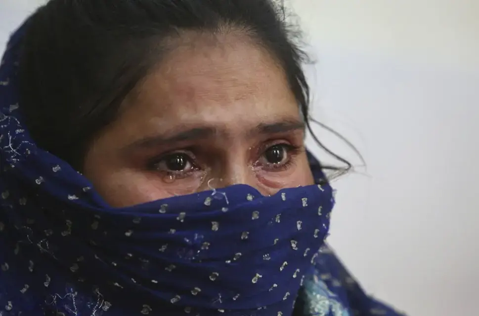 In this Thursday, Oct. 31, 2019, photo, Jyoti Rani, a recovering tramadol drug user, breaks down while narrating her story at a de-addiction center in Kapurthala, in the northern Indian state of Punjab. Rani’s addiction began with heroin. When her 14-year-old son died, she fell into depression. “I wanted to kill myself, but I ended up becoming an addict,” she cried. A doctor prescribed tramadol to help kick the habit, instead, she formed a new one. She locked herself in her room, not eating or taking care of two children. Rani used tramadol until she ran out of money and entered treatment. Now her family tells her she’s her old self again. Image by Channi Anand / AP Photo. India, 2019.