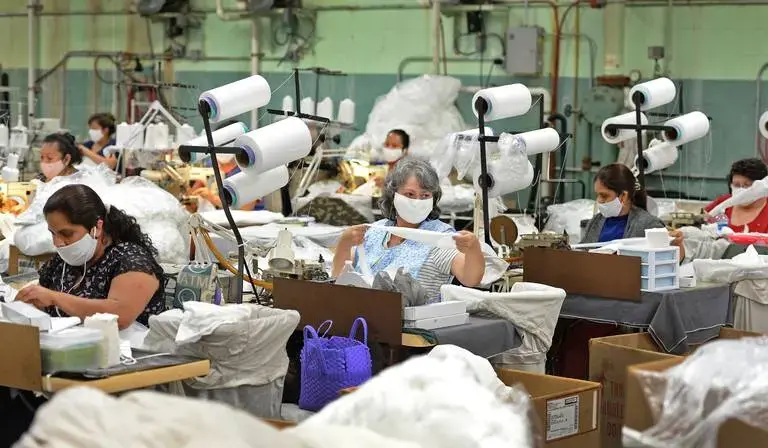 ASHEBORO, NORTH CAROLINA - Sewers work on various textile products at the Bossong Medical plant in Asheboro, N.C. on Thursday, July 16, 2020. Nufabrix contracted the Bossong Medical plant to make Theramasks. Image by Jeff Siner/The Charlotte Observer/North Carolina News Collaborative. United States, 2020.