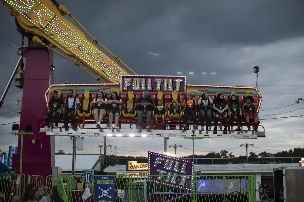 Visitors to the Perry State Fair in New Lexington, Ohio ride the “Full Tilt.” Image by Wong Maye-E/AP Photo. United States, 2020.