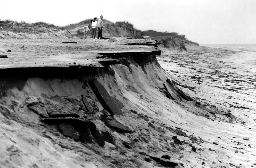 1991: Storm damage to the beach and parking lot at Meadow Beach in Truro after the 'Perfect Storm' of 1991. Image by Mark Wilson. United States, 1991.