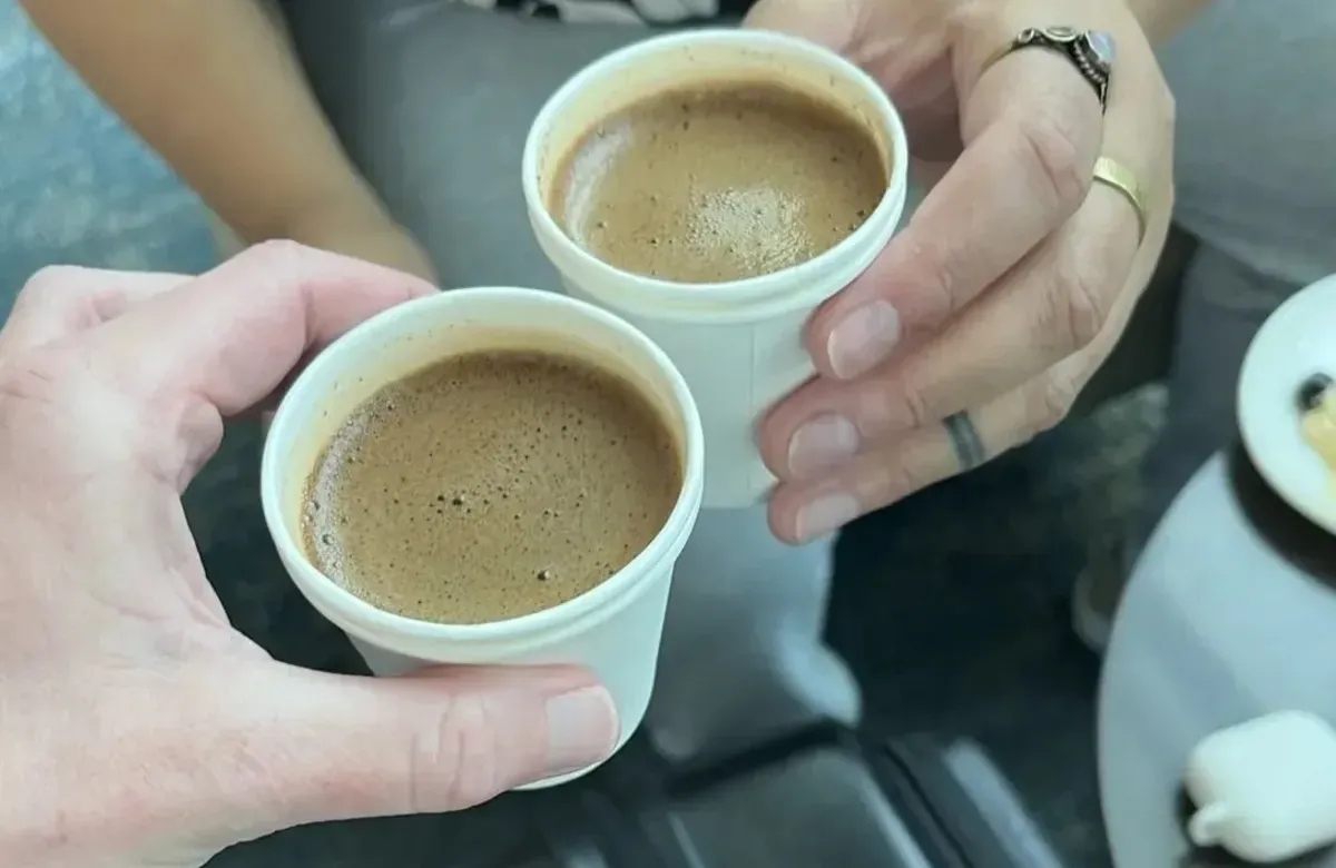 Cheers with coffee cups