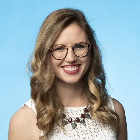 photo of emily in front of blue background